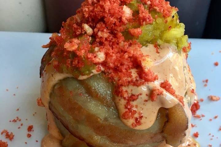 Pimento Mac Burger Stuffed Onion Ring Wrapped in Bacon with Lava BBQ Sauce, B&B Pickle Relish, Hot Cheeto Crumbles