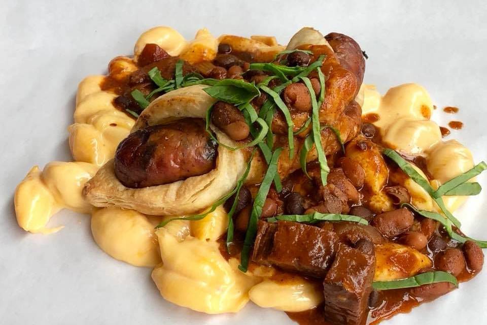 Jalapeño sausage rolled in puff pastry with mac n cheese and brisket chili.