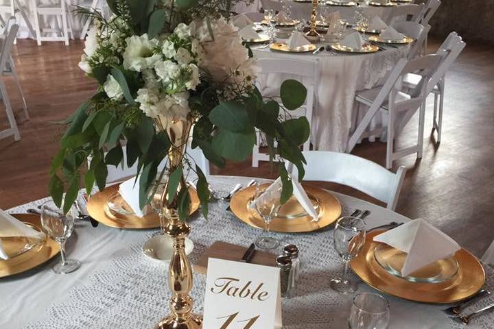 Round table setup with gold plates