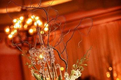 Elevated guest table arrangement of white orchids, lilies and hydrangea at the Ritz Carlton Sarasota