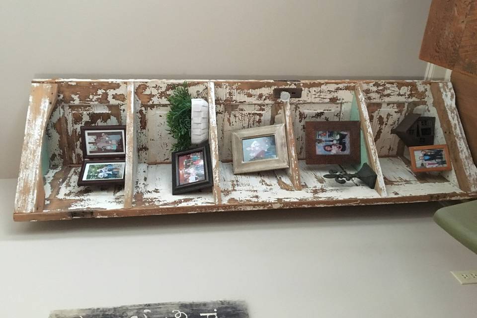 This beautiful corner shelf is an excellent way to show off pictures of those who are at your wedding in spirit or baby pictures of the bride and groom! $150 rental fee