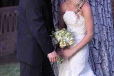 Bride and groom against giant cottonwood tree