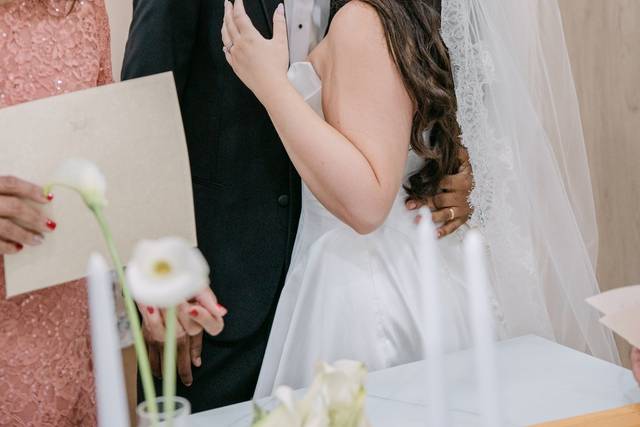 Groom and bride kissing