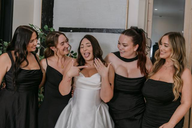Bride celebrating with bridesm