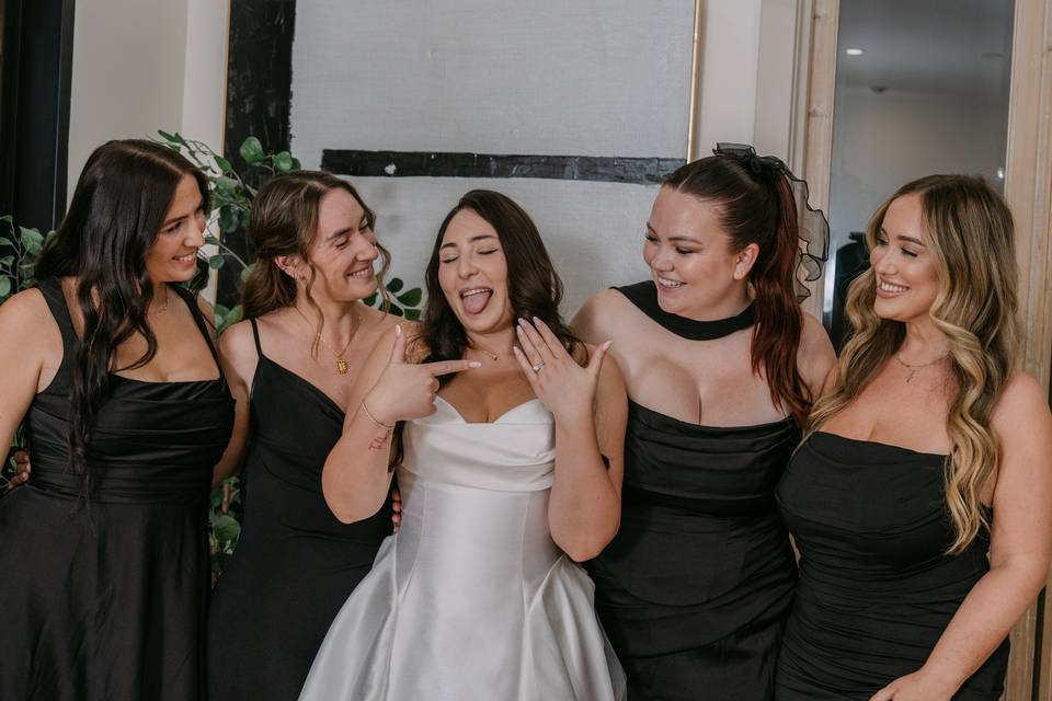 Bride celebrating with bridesm