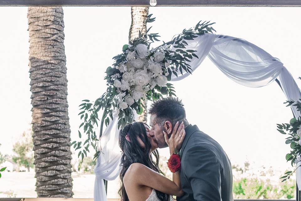Bride and groom first kiss
