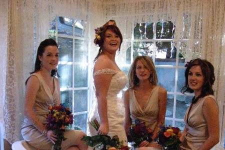 Bride and her bridesmaids sitting in the tub