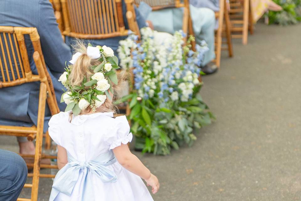 Flower girl walks down the aisle