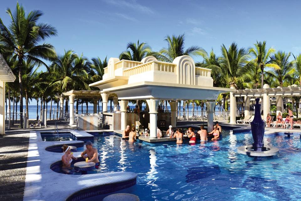 Our couples love the RIU Vallarta Pool Bar-cozy tables to relax and sip libations in the sun!