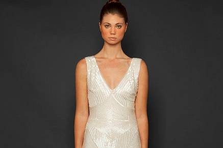 Style: Radiance
Sleeveless V-neck geometric white beaded embroidered mermaid gown