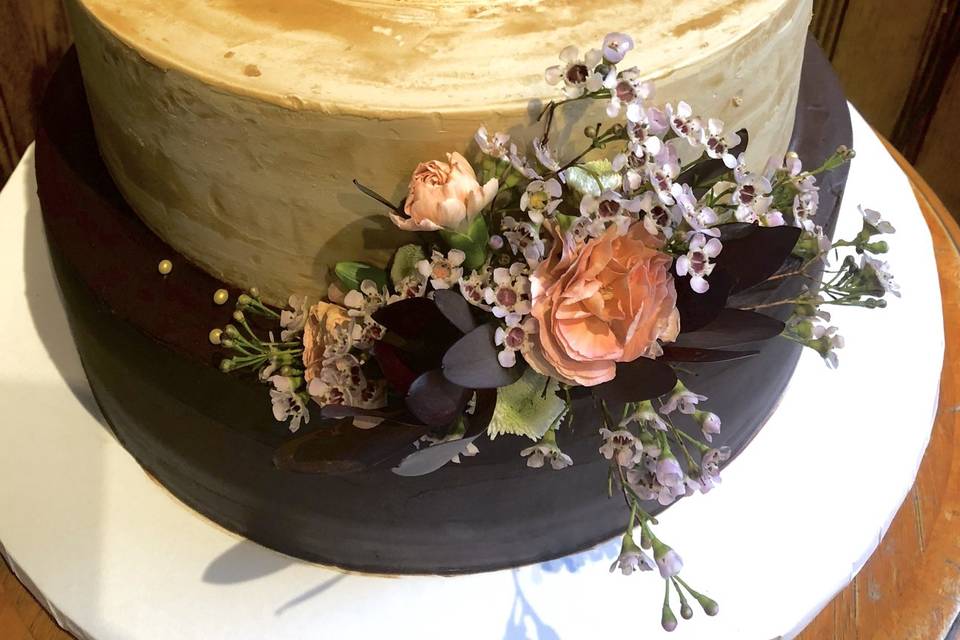 Fresh flowers on a caramel cake