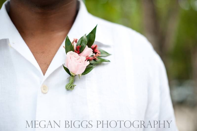 Pink rose boutonniere.