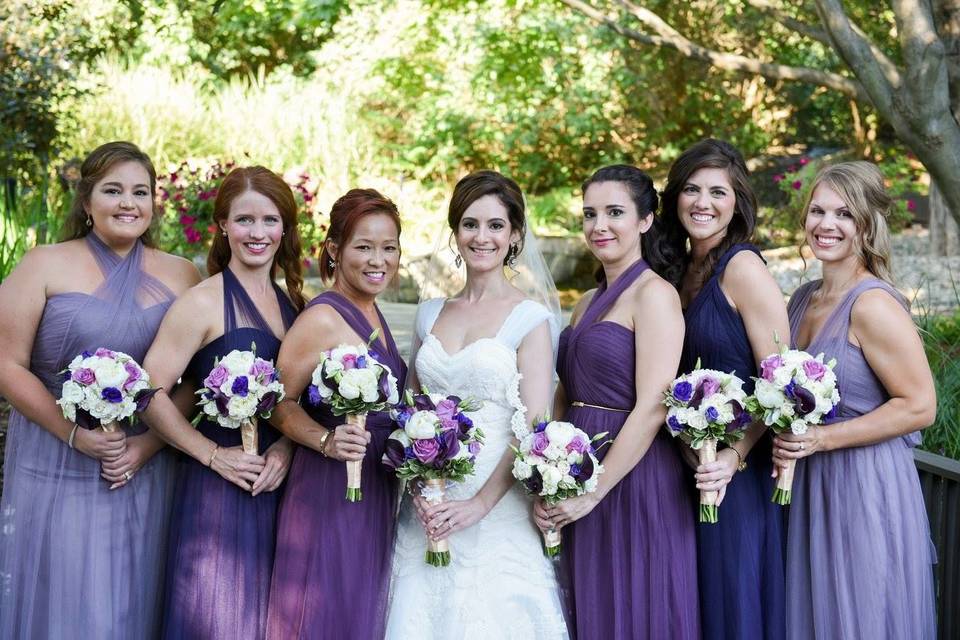 Bride and her bridesmaids in purple