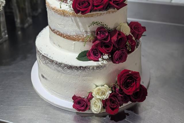 3 tier naked style wedding cake with red and white roses .jpg