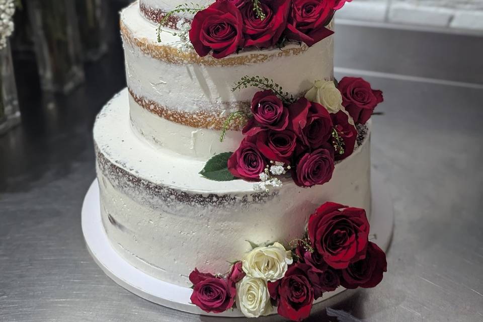3 tier naked style wedding cake with red and white roses .jpg