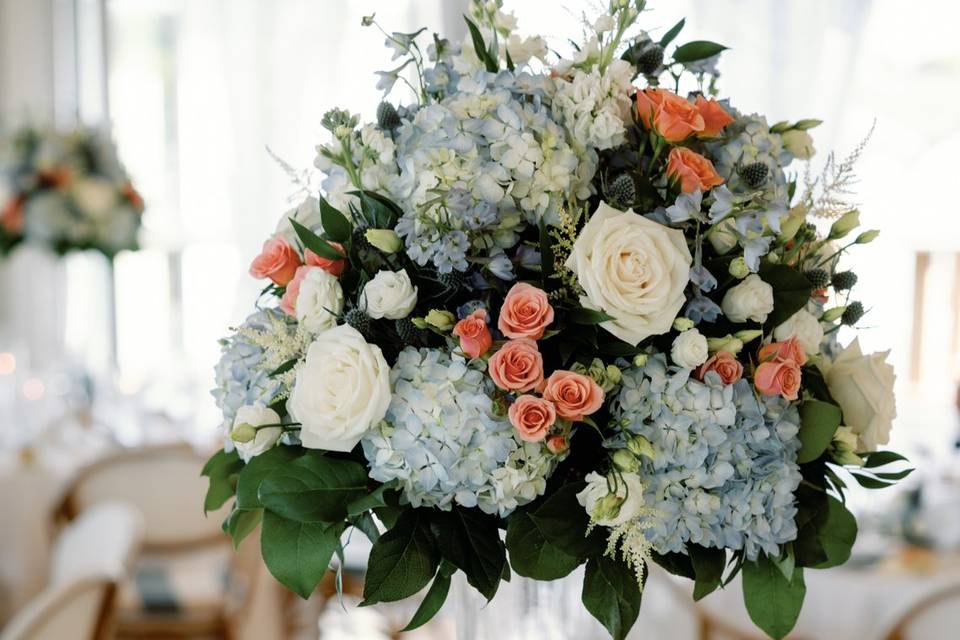 Tall blue and peach centerpiec