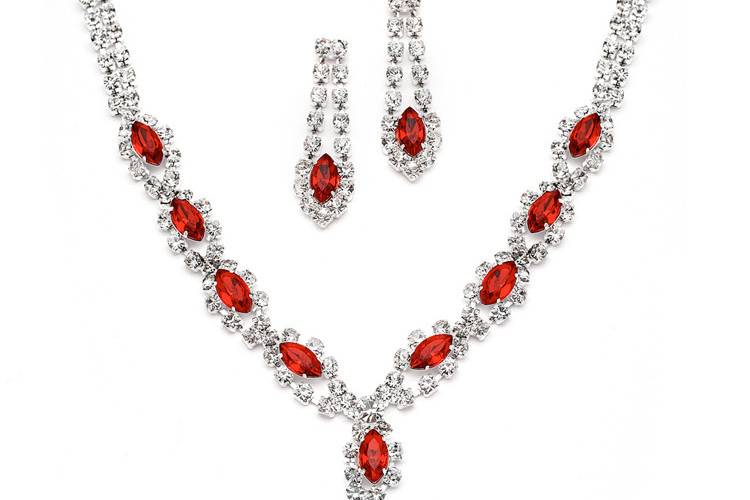 Reminiscent of fine diamond jewelry with a pop of bright red color, our classic prom necklace and earrings set is also wonderful for bridesmaids or pageants. The necklace is adj. 14