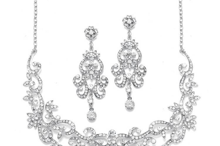 Mariell's fabulous bridal necklace and earrings set features a magnificent jewel encrusted crystal pavé scroll design which is truly a work of art! This luxurious set will make a breathtaking accessory for any wedding, pageant or special event. The earrings measure 2 3/4