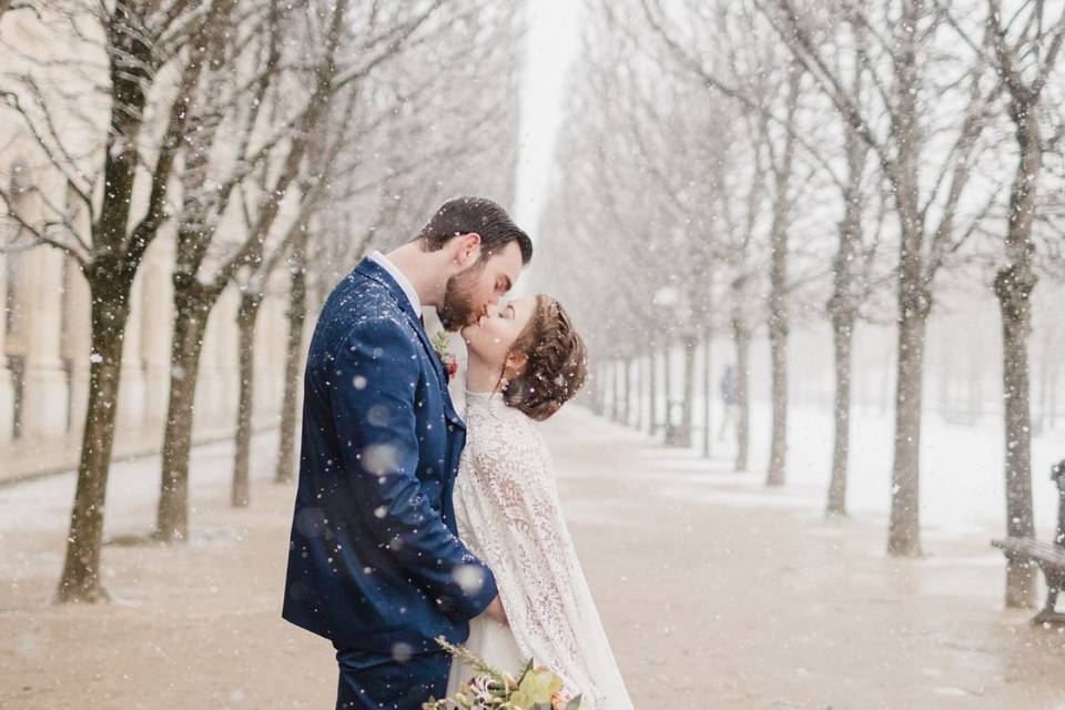 Fishtail braided updo for this Snowy winter elopement in Paris, France. Photo courtesy of Courtney Bowlden Photography . This wedding was featured in Destination Wedding Details