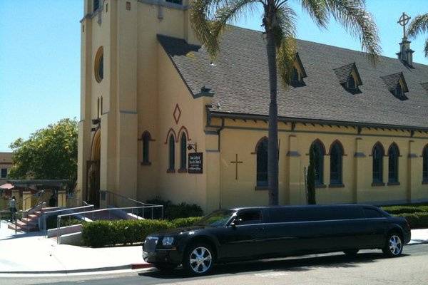 This is a picture of our brilliant gleaming limousine parked outside Our Lady of Angels Catholic Church in San Diego. We provided service picking up and dropping off the bridal party for a wedding held on 6/4/11