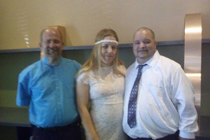 Bride, groom, and officiant