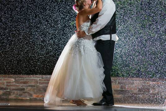 Bride and groom at their rainy wedding reception at Firestone Country Club