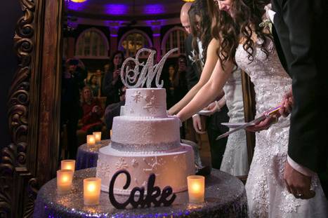 cutting the wedding cake at the ballroom at park lane