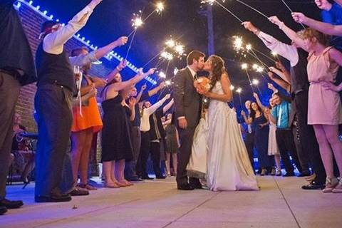 Couple kissing under sparklers