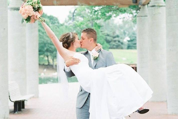 Groom carrying bride