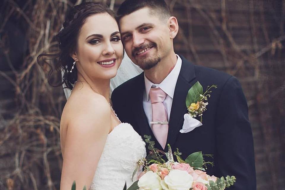 Bride and groom holding flowers