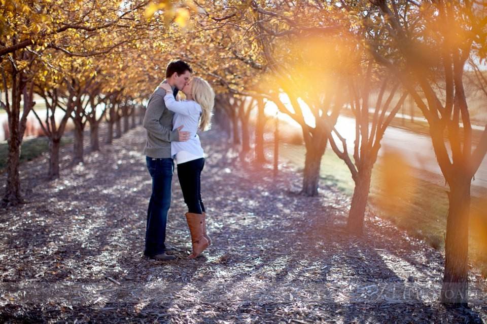 Engaged couple in orchard