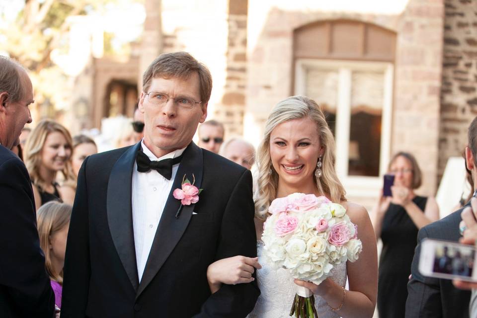 Emotional bride walking down the aisle