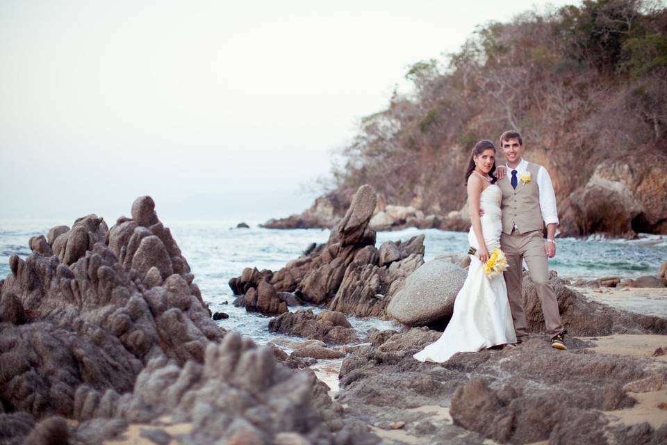 Dramatic image of couple on rocks