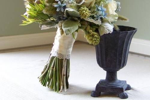 Bridal bouquet with tweedia, hydrangea, dusty miller, Vendela roses, bunny tail grass, tuberoses and Leucadendron ‘Pisa’