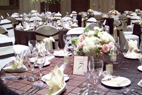 tall centerpiece with pink and white snapdragons and larkspur