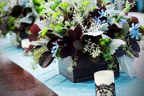 centerpiece with cotinus, tweedia, dusty miller, seeded eucalyptus, and bupleurum in a wooden box