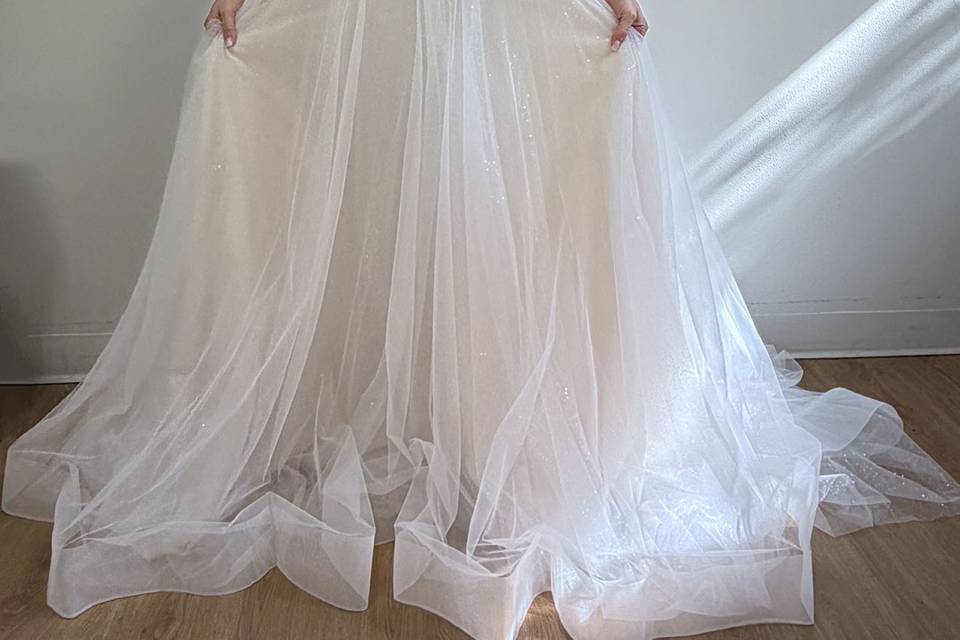 Ivory and Nude Wedding Gown with a long train worn by an actual customer (1).jpg