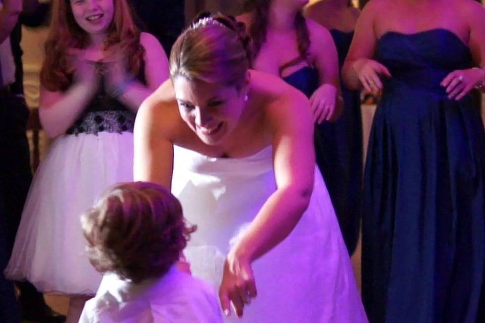 Bride dancing with the kid