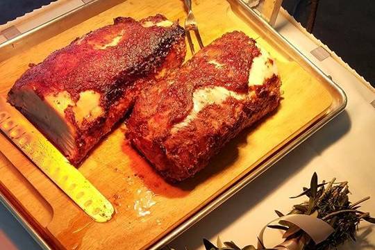 Our rosemary rubbed pork loin roasted with a strawberry syrup served at a carving station.