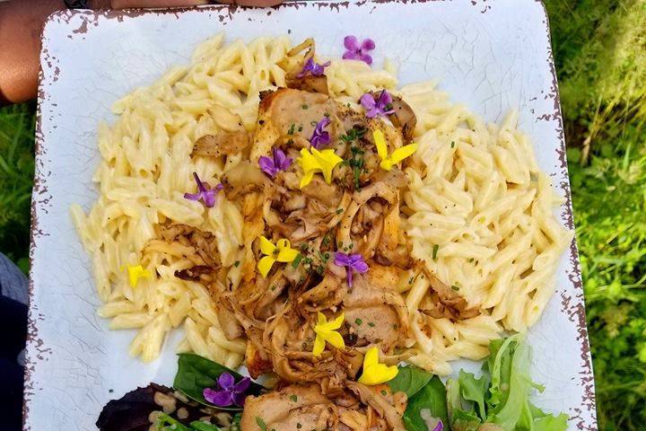 Local pike topped with homegrown oyster mushrooms, chives, forsythia and lilac petals.