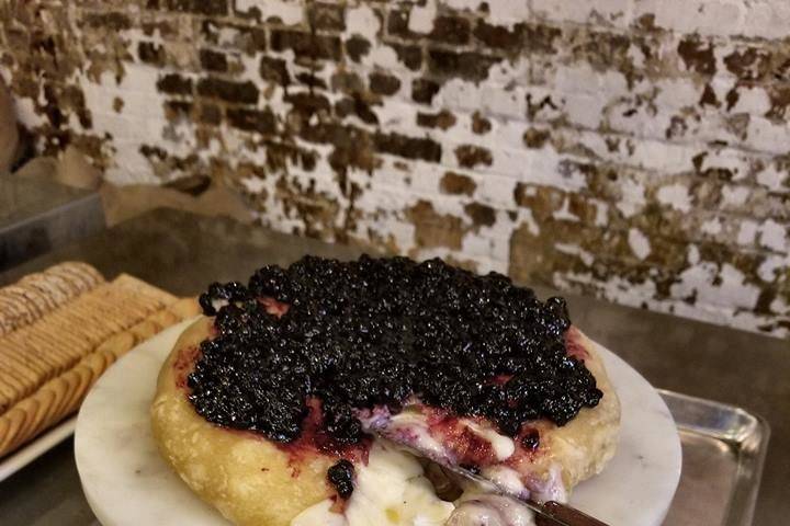 Oozy baked brie with huckleberry compote.