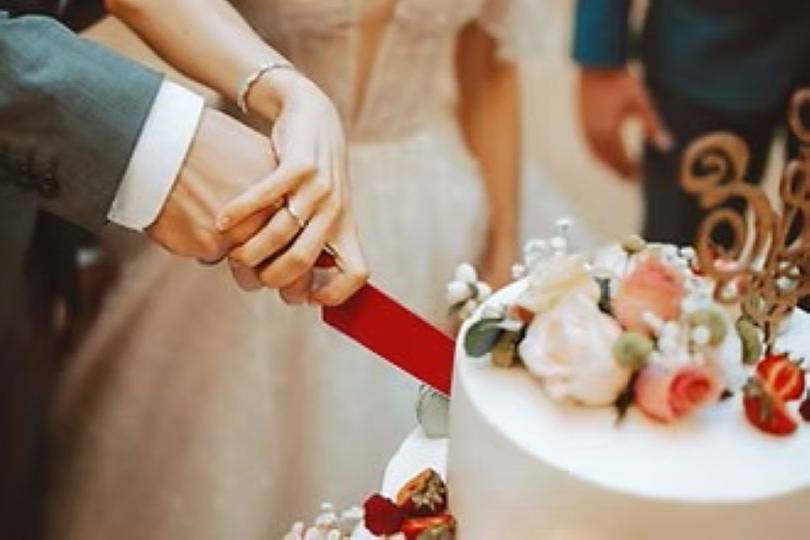 Couple Cutting Wedding Cake