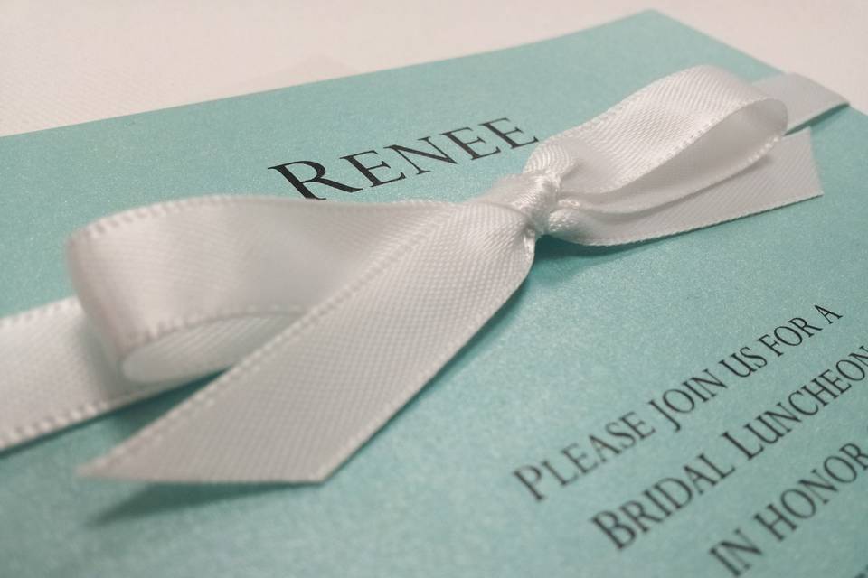 Tiffany-blue shimmer shower invitation with white satin ribbon detail.
