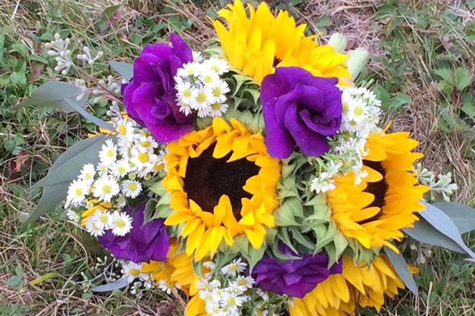 Sunflowers and purple roses