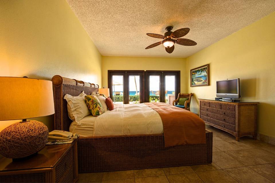 The bedroom space of a one-bedroom suite. All rooms are unique in their configurations but all one-bedroom suites offer separate living space, kitchen, extra bathroom, washer/dryer and other amenities.