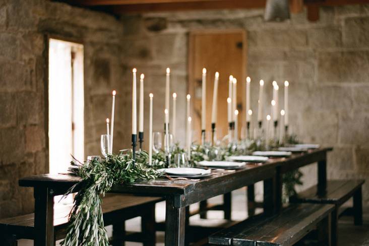 Long table setting with candle centerpiece