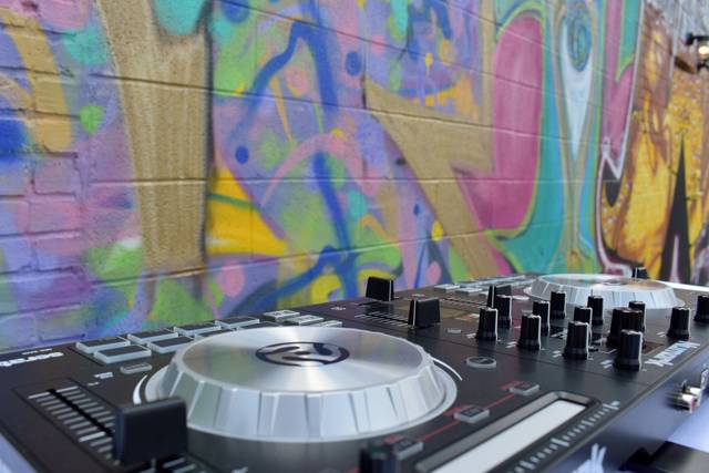 I use a Numark Controller, two Mac Book Pro's and a Tablet to spins the tunes.