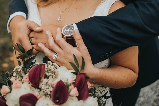 Groom hugging his bride