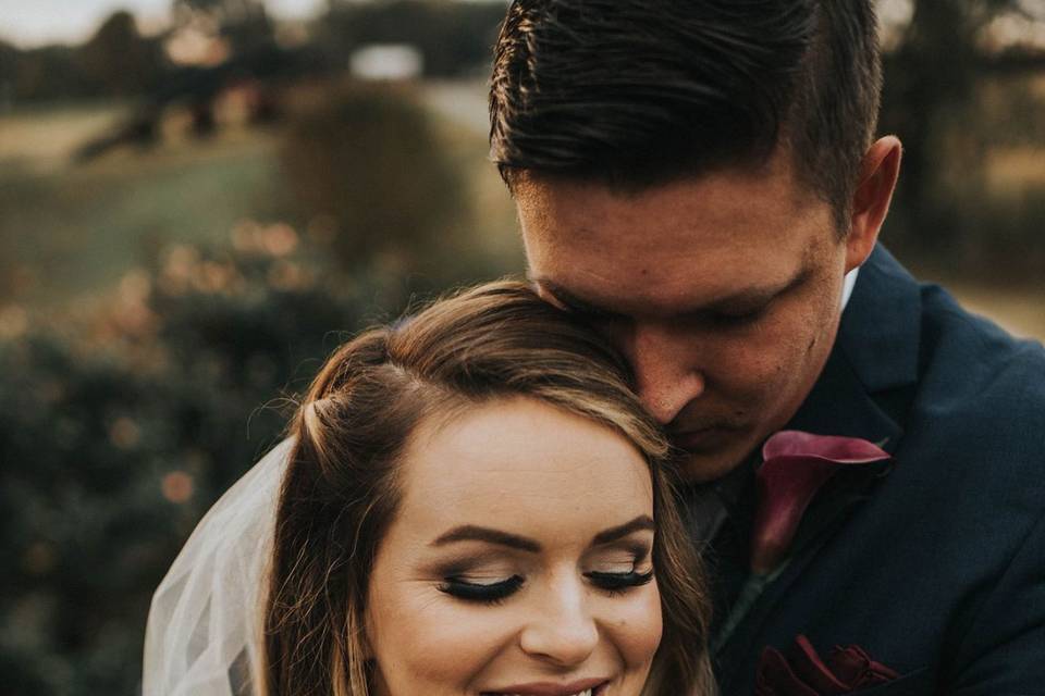 Groom hugging his bride