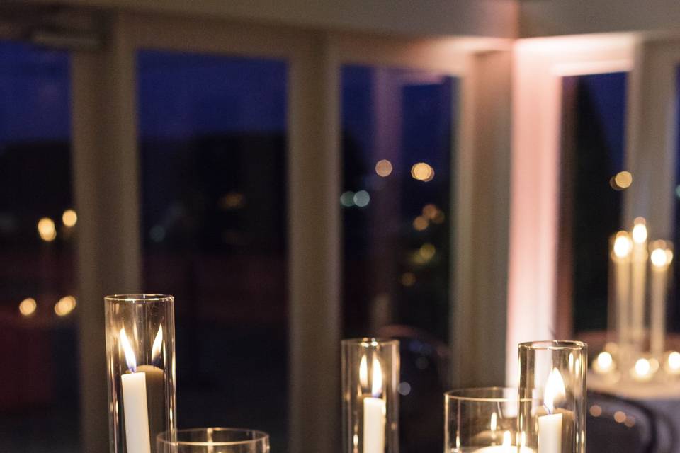 Table setup with candle and flower centerpiece